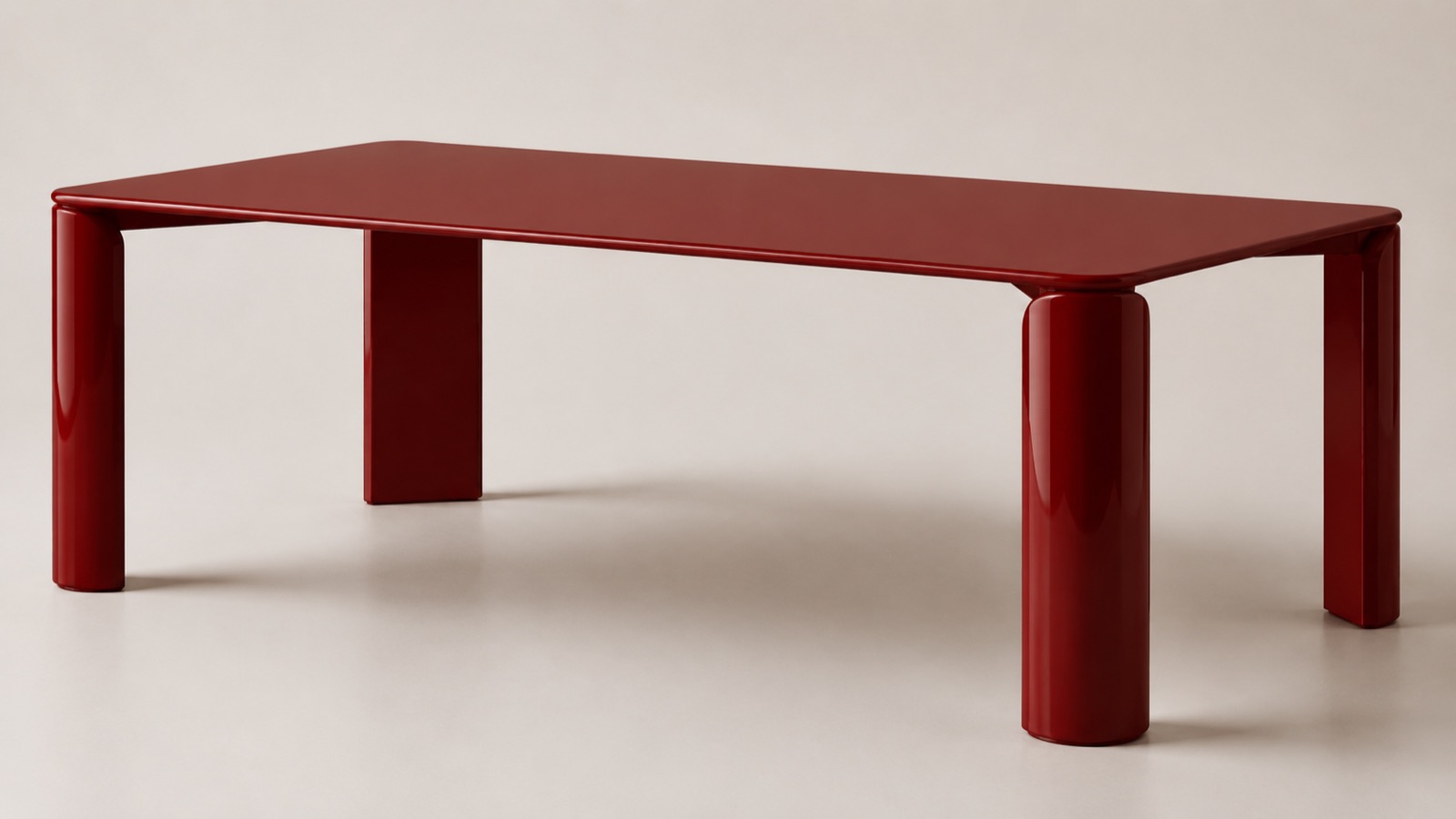 Monolite matbord i blank rostrött lackfinish, två cylindriska ben och två platta ben